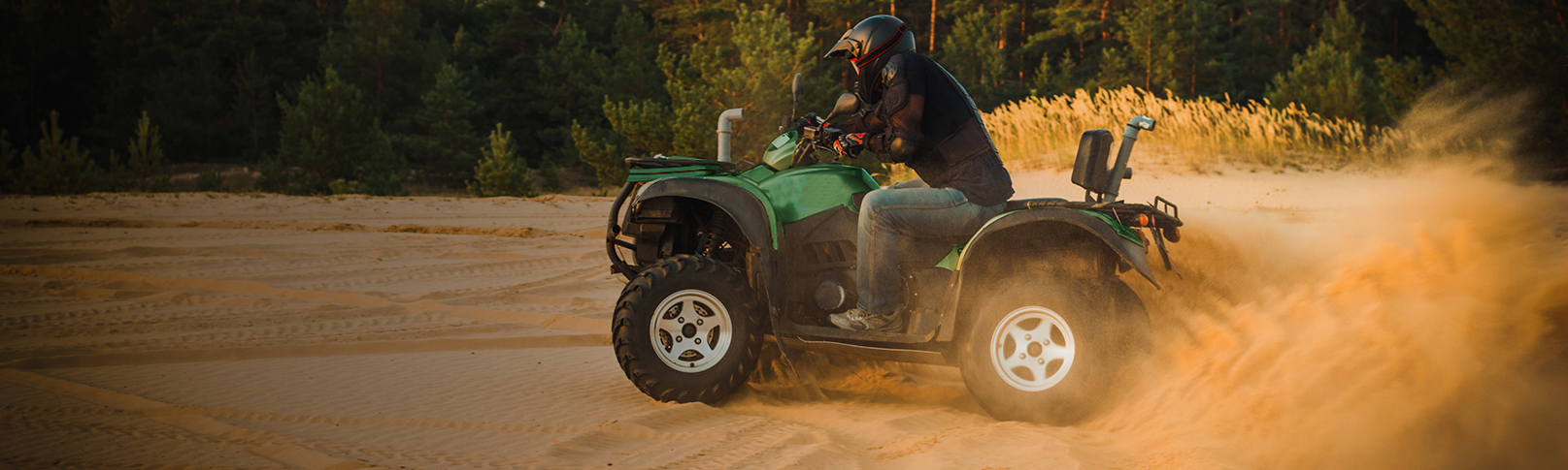 Man riding four wheeler in the sand