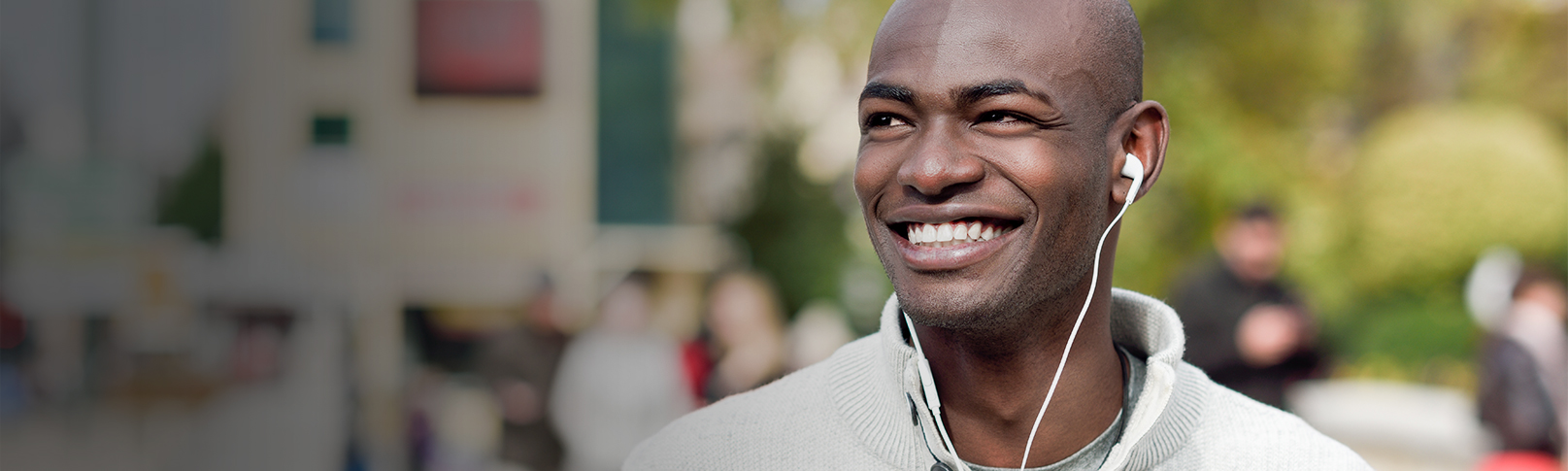 Young male smiling while listening to music