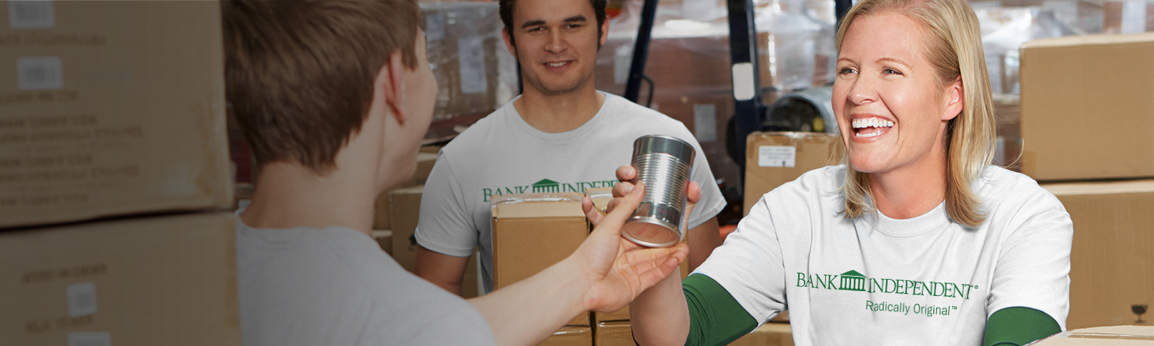 picture of a man handing a woman a can of food