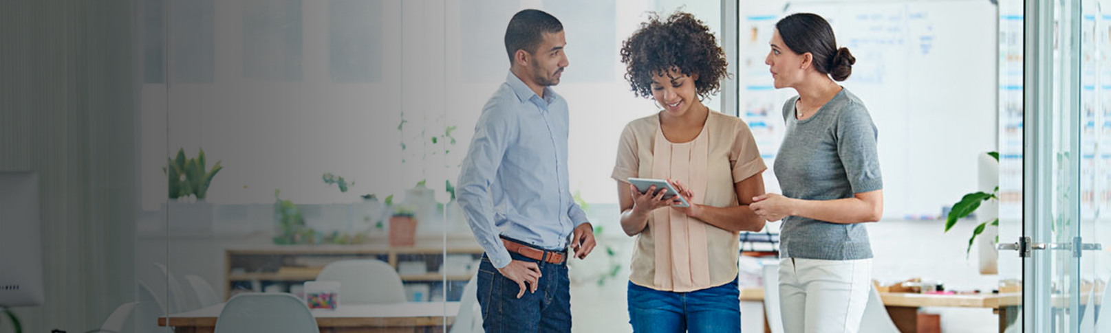 Business Office Discussion Between Three People